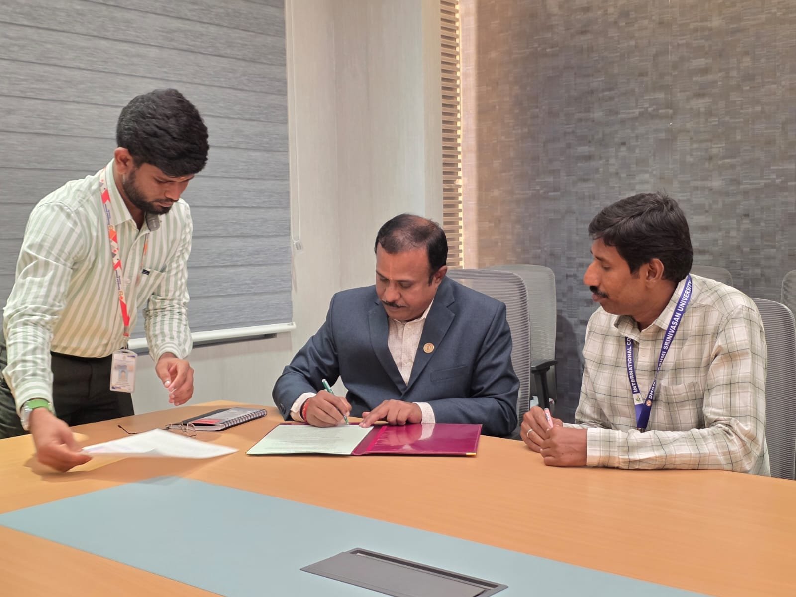 Representatives signing an institutional document